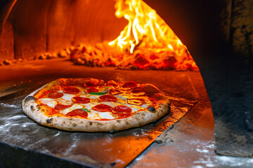 Pepperoni pizza in wood-fired oven