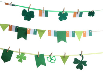 Paper garland with clover and Irish flags for St. Patrick's Day celebration on white background