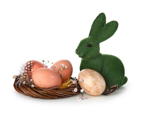 Easter eggs in nest and bunny on white background