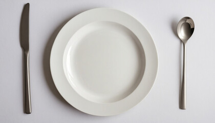 Top view of a blank white plate on the table