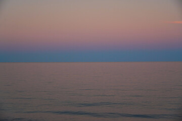A pink and blue sunset over the ocean
