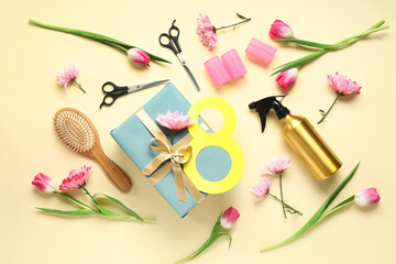 Composition with hairdresser's supplies, gift box and flowers for International Women's Day on color background