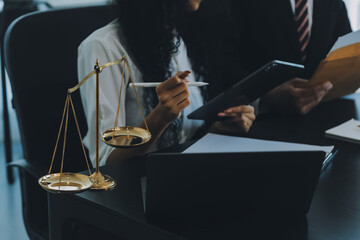 Judge gavel with Justice lawyers having team meeting at law firm background. Concepts of Law and...