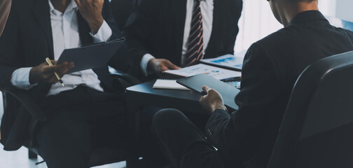 Business team meeting working with new startup project, discussion and analysis data the charts and...