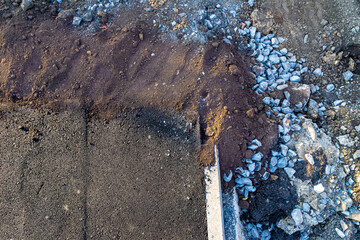 partially constructed pavement, due to the partial implementation of a development project, selective focus