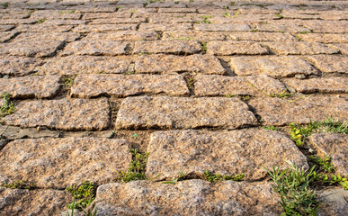 Detailed close views on cobblestone streets and sidewalks in different perspectives, with small...