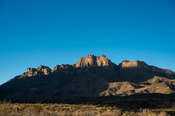 Dark Shadows Begin To Fill The Valley Below Crown Mountain In Big Bend