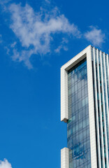Obraz premium City high-rise buildings against the blue sky. Office apartments.