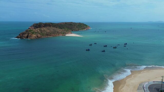 Aerial landscape at Hon Kho beach, Binh Dinh, Vietnam with islands and fishermen's fishing boats in the daylight. Concept of marine nature and travel.
