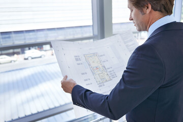 Blueprint, architecture and man in office for planning, building project and real estate...