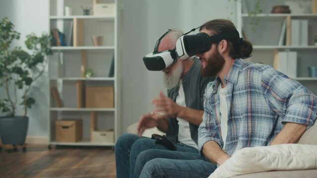 Cross-generational VR interaction: young and elderly playing in virtual reality, using VR technologies together, joystick gaming, elder tech learning, family fun, uniting through innovative games