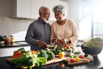 A couple of black seniors cooking the dinner together in a modern kitchen