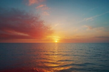 Fototapeta premium Stunning red, yellow, and blue gradient background fading into soft white, reminiscent of a dreamy sunset over the ocean