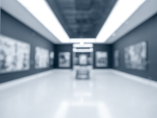 Blurred perspective photo scene of art exhibition at gallery or museum with paintings or artist...