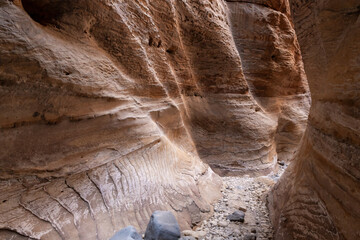 Bizarre natural patterns on mountain walls on tourist route of gorge Wadi Al Ghuwayr or An Nakhil...