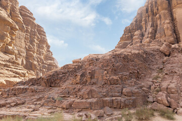 Unforgettable shapes of the high mountain peaks in the red desert of the Wadi Rum near Amman in Jordan