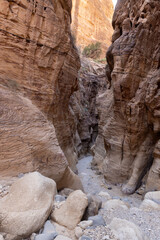 High mountains on both sides of tourist route of gorge Wadi Al Ghuwayr or An Nakhil and wadi Al Dathneh near Amman in Jordan