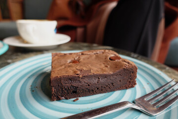 slice of brownie on plate on table 