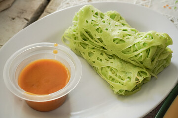 Roti jala is a typical Malay food in North Sumatra and served with curry sauce. Usually served as a takjil menu during the month of Ramadan.