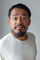 Obraz premium Portrait of angry moustache artist asian man emotion facial face