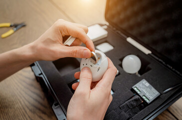 A technician works with a demo kit of the smart home system