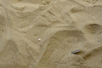 Fototapeta na wymiar Sand at the beach for background. Brown sand