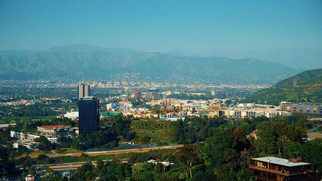 Studio City, California, United States &ndash; April 16, 2019: Universal Citywalk overlook. Hogwarts Cattle. Universal City Theme Park aerial view. Breathtaking look on city from the hills in slow motion.