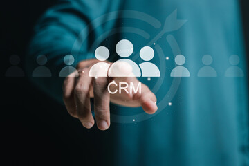 CRM, Customer relationship management business. Businessman touch virtual CRM word and human icon. Customer focus group. Digital marketing online, CRM, Data exchanges development and customer service.