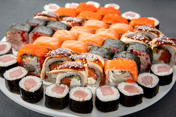 Assorted sushi and maki rolls platter with tuna, salmon, and eel, perfect for a Japanese cuisine experience