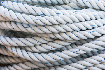 Fototapeta premium Close up of ropes piled near the port