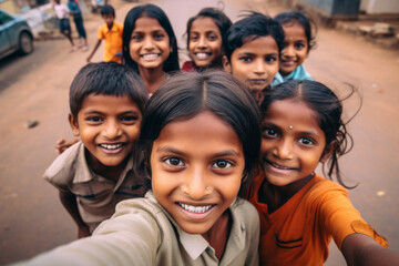 A group of rural smiling Indian kids make a selfie outside, childish spontaneity - obrazy, fototapety, plakaty