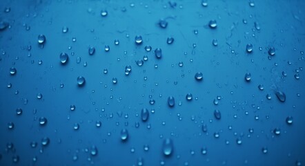 Blue Water droplets on glass