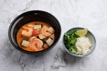 Tom yum soup with shrimp and rice bowl