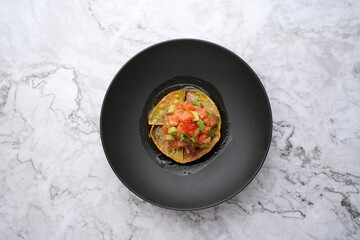 Smoked Salmon Tostada with red caviar and avocado