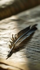 a feather quill resting on a piece of paper