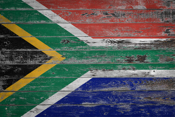 The national flag of  South Africa  is painted on uneven wooden  boards. Country symbol.