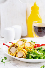 Ketogenic breakfast. Omelette with sausage. Sausage roll in omelette with lavash. Keto, ketogenic lunch. 