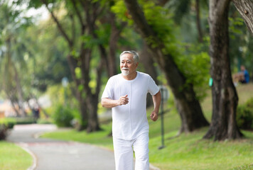 senior man running and exercising in the park