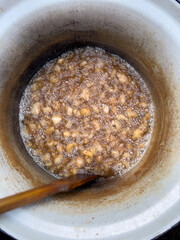 cooking traditional lard cracklings in big pot