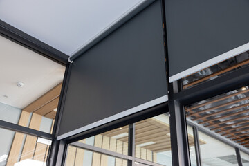 blind curtain or black blinds Roller sun protection in office.