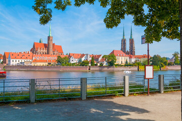 A view of Ostrów Tumski in Wrocław on a sunny day. In the background, you can see the Cathedral...