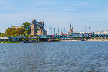 A view from a boat sailing on the Odra River. The view to the Peace Bridge. Peace Bridge is located...