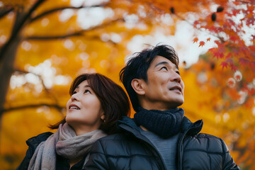 adult heterosexual Asian couple in beautiful autumnal nature. Neural network generated image. Not based on any actual scene or pattern.
