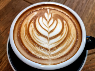 Sideway shop coffee, close-up hot latte art coffee background.