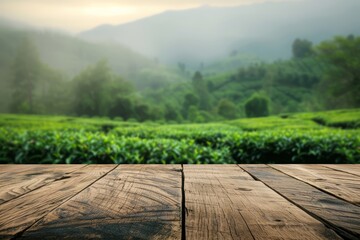 Empty wooden kitchen table over blurred tea plantations background. mock up.
