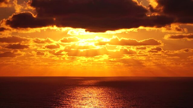 Aerial view. Dramatic sunset with sea and gloomy clouds. Abstract aerial nature summer ocean sunset sea and sky background. Horizon. Vacation, travel and holiday concept. Weather and climate change