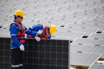 Photovoltaic engineers work on floating photovoltaics. Inspect and repair the solar panel equipment...