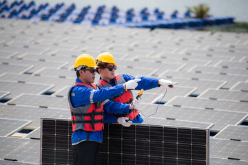 Photovoltaic engineers work on floating photovoltaics. Inspect and repair the solar panel equipment...