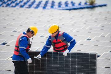 Photovoltaic engineers work on floating photovoltaics. Inspect and repair the solar panel equipment...