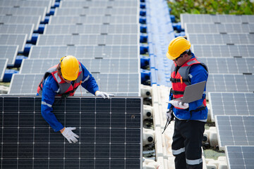 Photovoltaic engineers work on floating photovoltaics. Inspect and repair the solar panel equipment floating on the water.